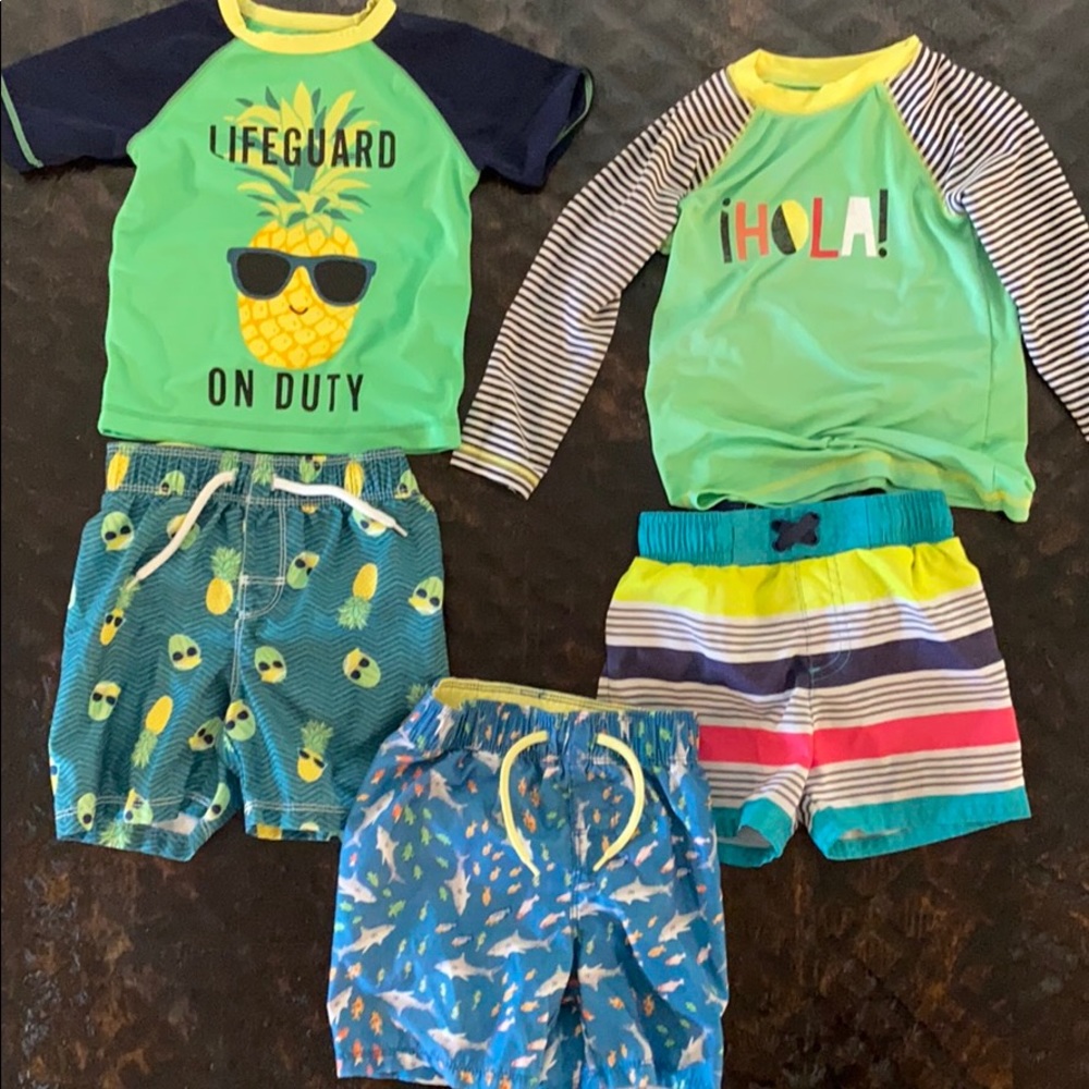 Lot of boys swim shorts and shirts